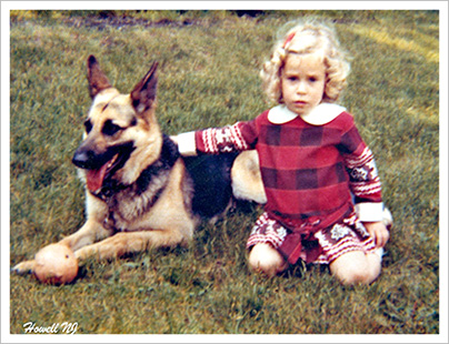 Owner, Beth Ramsey as a little girl with her dog